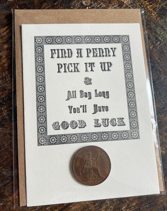 Hand-printed letterpress card reading 'Find a penny, pick it up, and all day long you'll have good luck', with an old pre-decimal penny and a kraft envelope